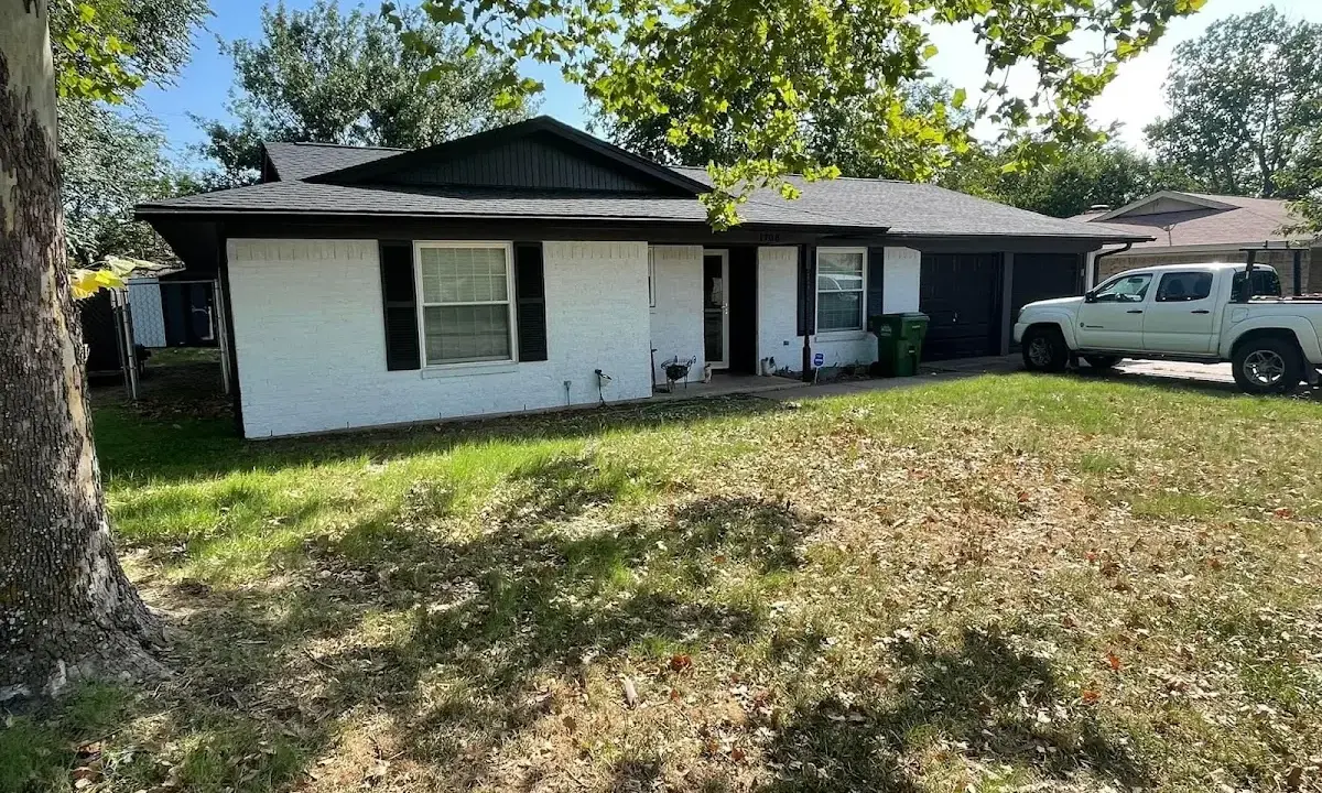 Professional roofing crew working on a residential roof in Offutt AFB